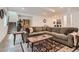 Spacious basement featuring comfortable seating, stylish decor, and access to the stairs at 11253 Moondance Trl, Littleton, CO 80125