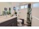 Well-lit bathroom boasts shower, vanity, modern fixtures, and neutral finishes at 11253 Moondance Trl, Littleton, CO 80125