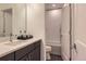 Modern bathroom with quartz countertop vanity and shower with shower/tub combo at 11253 Moondance Trl, Littleton, CO 80125