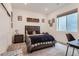 Cozy bedroom features neutral carpet, nice decor, and natural light from the window at 11253 Moondance Trl, Littleton, CO 80125