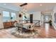 Open dining area with modern chandelier and stylish decor at 11253 Moondance Trl, Littleton, CO 80125