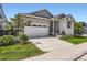 Charming home with a two-car garage and landscaped front yard at 11253 Moondance Trl, Littleton, CO 80125