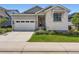 Charming single-Gathering home with a well-manicured lawn and attached two-car garage at 11253 Moondance Trl, Littleton, CO 80125
