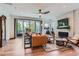 Cozy living room featuring modern furnishings, fireplace, and sliding doors at 11253 Moondance Trl, Littleton, CO 80125