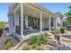 Covered patio with outdoor seating and barbeque area overlooking a landscaped yard at 11253 Moondance Trl, Littleton, CO 80125