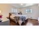 Cozy bedroom with hardwood floors and a comfortable bed at 1284 S Elizabeth St, Denver, CO 80210