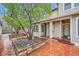 Exterior view of a brick paved courtyard with garden beds and building entrance at 753 Pearl St, Boulder, CO 80302