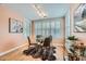 Cozy dining room with large windows, plantation shutters, and a glass-topped table at 753 Pearl St, Boulder, CO 80302