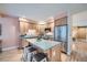 Modern kitchen with stainless steel appliances and granite countertops and island seating at 753 Pearl St, Boulder, CO 80302