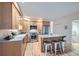 Bright kitchen features stainless steel appliances, granite countertops, and island with breakfast bar at 753 Pearl St, Boulder, CO 80302