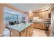 Well-lit kitchen with a granite island and dining area at 753 Pearl St, Boulder, CO 80302