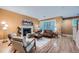 Warm living room featuring a fireplace, hardwood floors, and lots of natural light at 753 Pearl St, Boulder, CO 80302