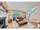 Bright living room featuring hardwood floors, a fireplace, and natural light at 753 Pearl St, Boulder, CO 80302