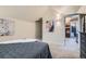 Bedroom showcases ensuite bathroom access, plush carpeting, and neutral paint at 753 Pearl St, Boulder, CO 80302