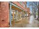 Charming brick building featuring a street-side patio with small tables and seating at 753 Pearl St, Boulder, CO 80302