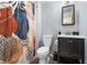 Bathroom with a modern vanity, mirror, and a shower over the bath with abstract botanical themed shower curtain at 9494 Devonshire Pl, Highlands Ranch, CO 80126