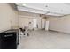 Spacious two-car garage with ample storage space, a door to the inside, and an automatic door opener at 9494 Devonshire Pl, Highlands Ranch, CO 80126