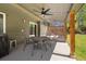 Covered patio with ceiling fan, dining table, and chairs perfect for outdoor relaxation and entertaining at 9494 Devonshire Pl, Highlands Ranch, CO 80126