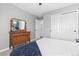 Neutral bedroom with closet and dresser at 3981 Starflower Rd, Castle Rock, CO 80109