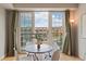 Bright dining area with a round table, white chairs, and a large window showcasing city views at 640 11Th St # 302, Golden, CO 80401