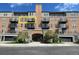 Spacious condo building featuring black balconies, lovely trees, and a convenient drive-in garage at 640 11Th St # 302, Golden, CO 80401