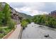 Riverfront property with apartments, beautiful landscaping, and mountain views near a walking path at 640 11Th St # 302, Golden, CO 80401