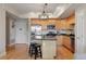 Modern kitchen with granite countertops, a central island with seating, and stainless steel appliances at 640 11Th St # 302, Golden, CO 80401
