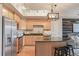 Charming kitchen with granite counters, an island with bar seating, and stainless steel appliances at 640 11Th St # 302, Golden, CO 80401