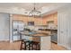 Bright kitchen featuring granite countertops, stainless steel appliances, a kitchen island, and light cabinetry at 640 11Th St # 302, Golden, CO 80401