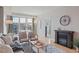 Sunlit living room with a fireplace, a decorative rug, and a large window offering great views at 640 11Th St # 302, Golden, CO 80401