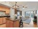 Open-concept living space with a kitchen island, wood floors, modern lighting and stylish decor at 640 11Th St # 302, Golden, CO 80401