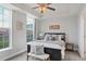 Bright bedroom with a ceiling fan, natural light, and minimalist decor for relaxation at 640 11Th St # 302, Golden, CO 80401