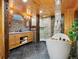 Bathroom featuring dual sink vanity, a glass enclosed tiled shower and a soaking tub at 6066 Crawford Gulch Rd, Golden, CO 80403