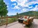 Inviting outdoor deck with comfortable seating and a fire pit, perfect for relaxation at 6066 Crawford Gulch Rd, Golden, CO 80403