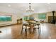 Open concept floorplan showing dining room, living room and mountain views through the windows at 6066 Crawford Gulch Rd, Golden, CO 80403