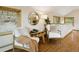 Living room with wood floors, neutral colored furniture, table and two windows at 6066 Crawford Gulch Rd, Golden, CO 80403