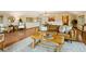 Living room with wood floors, brown sofa, area rug and many windows with mountain views at 6066 Crawford Gulch Rd, Golden, CO 80403