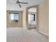 Bright bedroom featuring neutral carpet and a view outside at 5483 Ben Park Cir, Parker, CO 80134