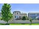 Rear exterior view of a two-story home showcasing a deck and a fenced backyard at 5483 Ben Park Cir, Parker, CO 80134