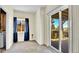 Versatile room with sliding doors to the backyard, featuring carpet, a window, and neutral walls at 5483 Ben Park Cir, Parker, CO 80134