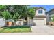 Charming two-story home with a well-maintained front yard and a two-car garage at 5483 Ben Park Cir, Parker, CO 80134