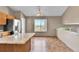 Bright eat-in kitchen with a large island, tile floors, and a scenic view at 5483 Ben Park Cir, Parker, CO 80134