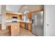 Well-appointed kitchen with wooden cabinets, stainless steel appliances, and granite countertops at 5483 Ben Park Cir, Parker, CO 80134