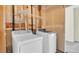Functional laundry area equipped with a side-by-side washer and dryer at 5483 Ben Park Cir, Parker, CO 80134