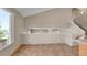 Open eat-in kitchen area with tile floors, neutral colors, and vaulted ceilings at 5483 Ben Park Cir, Parker, CO 80134