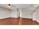 Spacious living room featuring hardwood floors and a ceiling fan at 5483 Ben Park Cir, Parker, CO 80134
