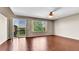 Spacious main bedroom featuring hardwood floors, ample natural light, and a ceiling fan at 5483 Ben Park Cir, Parker, CO 80134
