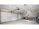 Large garage with multiple overhead doors and ample space for vehicles and storage at 1990 Ulster St, Denver, CO 80220