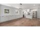 Bright, open kitchen featuring white cabinets, quartz countertops, and stainless steel appliances at 1990 Ulster St, Denver, CO 80220