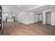 Open floor plan showcasing light wood floors and modern finishes with views leading to the kitchen at 1990 Ulster St, Denver, CO 80220